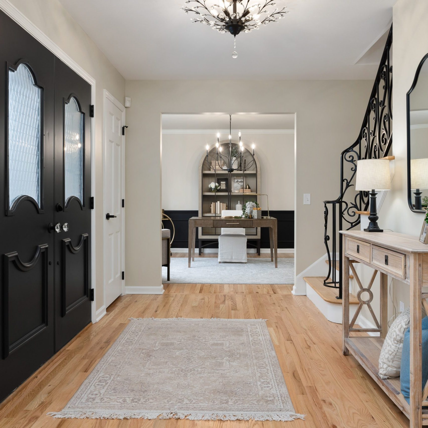 Remodeled home entry way looking into a home office staged in a Worthington Hills home.